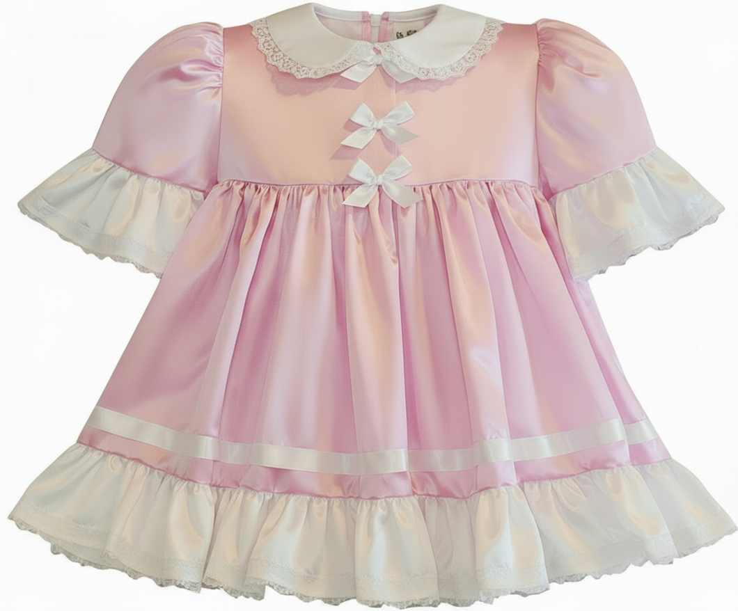 Pink and white dress with ruffled details on a white background