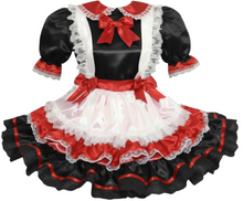 Black, red, and white sissy dress with ruffles and bows on a white background