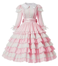 A pink and white long-sleeved Lolita-style dress with a tiered ruffled skirt, lace trim, and a white collar, shown on a plain white background.