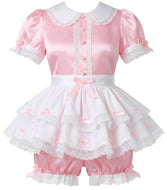 A pink and white short-sleeve adult babydoll-style costume or dress with a white Peter Pan collar, lace trim, ruffled skirt, bow details, and matching pink ruffled shorts, displayed on a mannequin against a white background.