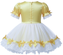 A yellow satin sissy dress with white chiffon overlay