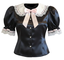 A black satin blouse with puff sleeves, a white lace Peter Pan collar, and a light pink ribbon bow at the neckline, shown on a plain white background.