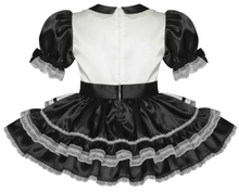 Black and white dress with lace details on a white background