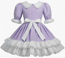 Purple checkered dress with white accents on a white background