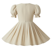 Beige dress with puff sleeves on a white background