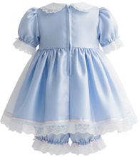 A light blue adult baby dress with short puff sleeves, a white ruffled collar, and a layered tulle skirt with white lace trim, shown against a plain white background.