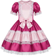 A pink and magenta Lolita-style dress with short puff sleeves, white lace trim, a large bow at the waist, and a tiered skirt, shown on a plain white background.