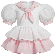 A sissy short-sleeve dress with a white top featuring a pink sailor collar and bow, paired with a layered pink tutu skirt.