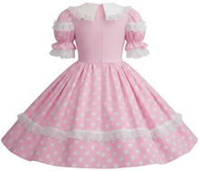 A pink and white polka dot sissy dress with a white collar and ruffled sleeves, shown against a plain white background.