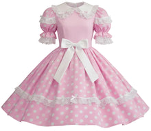 A pink and white polka dot dress with a white collar, lace trim, puffed sleeves, and a large white bow at the waist, shown against a plain white background.