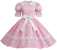 A pink and white polka dot dress with a white collar, lace trim, puffed sleeves, and a large white bow at the waist, shown against a plain white background.