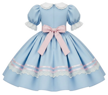 A light blue Lolita-style dress with white lace trim, puffed sleeves, and a large pink ribbon bow at the waist, shown against a plain white background.