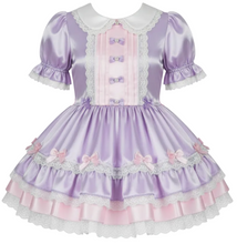 A lavender and pink Lolita-style dress with short puff sleeves, a peter pan collar, and a tiered skirt with bows and ruffles, shown on a plain white background.