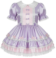 A lavender and pink Lolita-style dress with short puff sleeves, a peter pan collar, and a tiered skirt with bows and ruffles, shown on a plain white background.