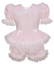 Pink baby romper with lace details on a white background