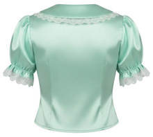 A mint green satin blouse with puffed short sleeves, white lace trim at the collar, and white lace trim at the sleeve cuffs, shown from the back on a white background.