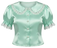 A mint green satin short-sleeve blouse with white lace trim, pearl buttons, and white lace bows on the collar, shown against a plain white background.