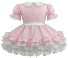 Pink taffeta sissy dress with white lace details on a white background