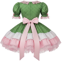 A green and white polka dot dress with puff sleeves, a large pink ribbon bow at the waist, and layered pink and white ruffles with lace trim.