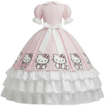 A pink and white Hello Kitty ball gown costume displayed on a mannequin against a white background. The dress features a light pink bodice with puff sleeves, a white bow at the waist, and a full white ruffled skirt printed with Hello Kitty cartoon characters.
