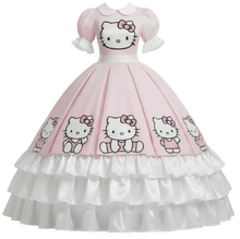 A pink Hello Kitty ball gown dress featuring a pink bodice with puff sleeves, a white collar, and a full skirt printed with multiple Hello Kitty faces, finished with a white ruffled underskirt.