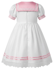 A white short-sleeve dress with a pink collar and pink striped trim on the sleeves and hem, shown against a plain white background.