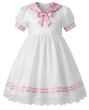 A white adult baby girl's dress with a pink sailor collar, pink ribbon trim, and a matching pink bow at the neckline, shown against a plain white background.