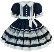 A navy blue and white Lolita-style dress with puffed short sleeves, a white collar, lace trim, a white waistband with a bow, and a tiered skirt with lace bands.