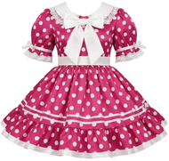 A pink and white polka dot sissy dress featuring short puff sleeves with lace trim, a large white bow at the collar, a white waistband, and a tiered ruffled skirt.