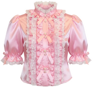 A pink satin blouse with ruffles, lace trim, and bow details, shown against a plain white background.