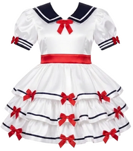 A white Lolita-style dress costume displayed against a plain white background. The dress features a navy blue collar, red ribbon accents, a red waistband, and multiple red bows on the tiered skirt.