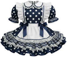 Navy blue sissy dress with white polka dots and ruffled details on a white background