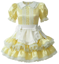 A pale yellow and white Lolita-style dress with short puff sleeves, a white collar, lace trim, a white apron-style waist panel, and a tiered ruffled skirt with lace edges.