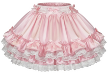 Pink and white ruffled skirt with lace details on a white background