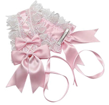 A pink satin and white lace headband set with large bows, delicate lace trim, and long ribbon tails, shown on a plain white background.