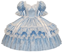 A light blue and white Lolita-style ball gown with puffed sleeves, lace trim, tiered ruffles, and long white ribbons, shown on a plain white background.