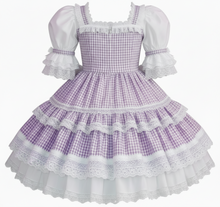 Purple checkered dress with white ruffles on a white background