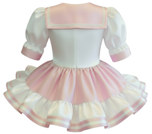 White dress with pink accents on a white background