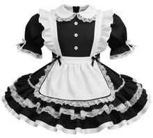 Black and white maid outfit with ruffled details on a white background