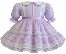 Lavender eyelet dress with lavender accents on a white background