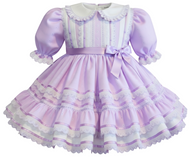 Lavender dress with white lace details on a white background