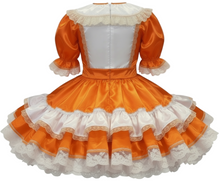 Orange and white dress with ruffled details on a white background