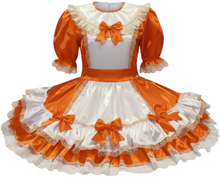 Orange and white dress with ruffles and bows on a white background