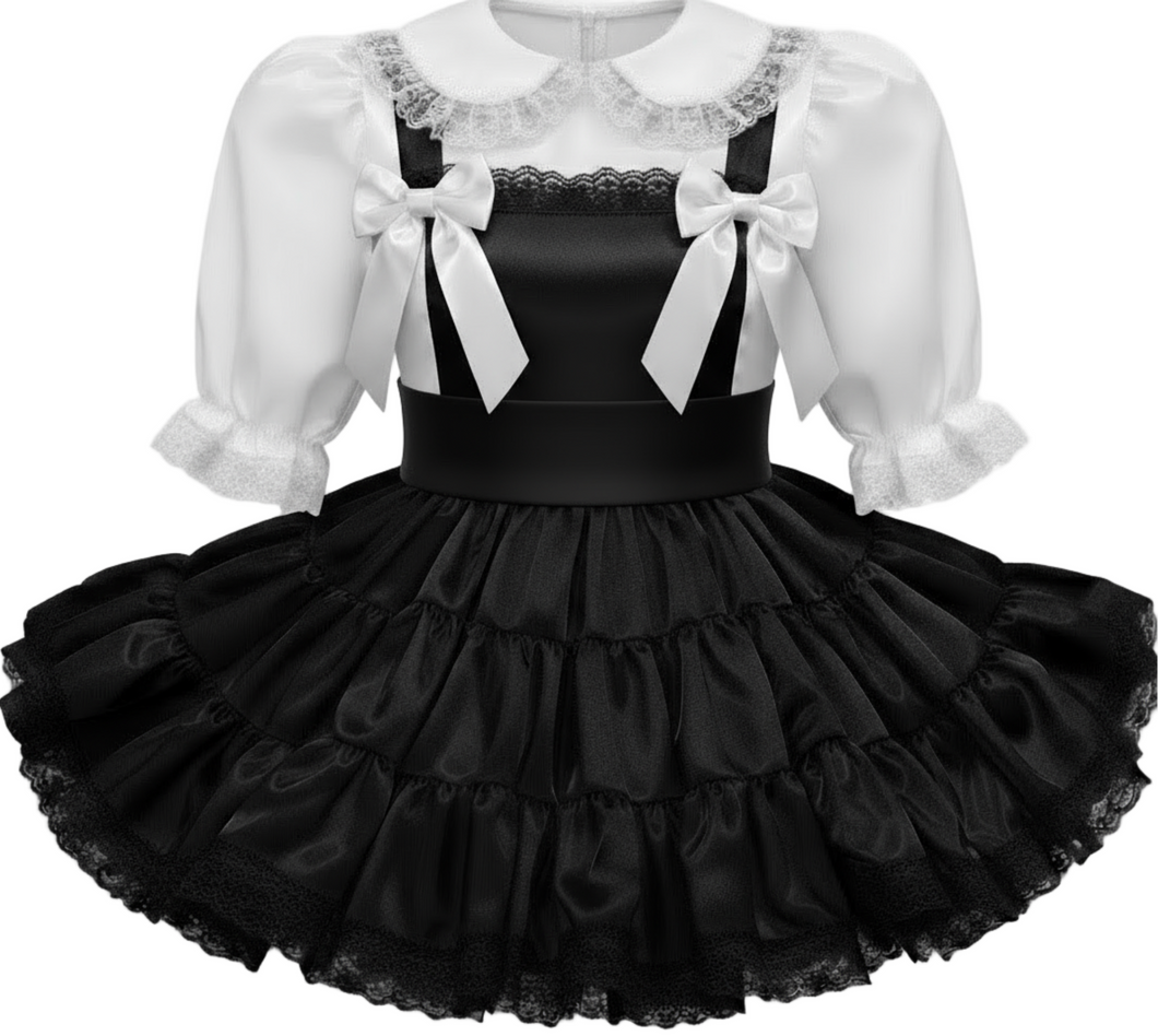 Black ruffled dress with white lace collar and sleeves on a white background
