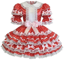 Red polka dot sissy dress with white ruffles and bows on a white background