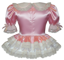 Pink satin dress with lace details on a white background