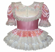 Pink and white dress with lace details on a white background