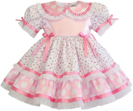 Pink and white dress with floral patterns on a white background