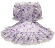 Purple and white floral dress with ruffles on a white background
