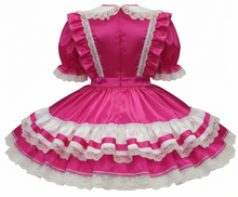 Orange dress with white lace details on a white background